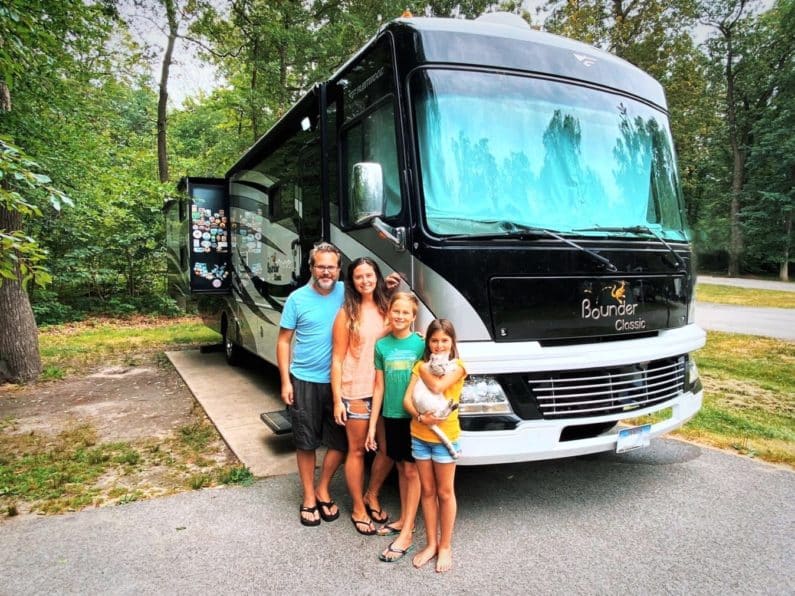 RVshare Family Of 4 and Cat in Front of RV