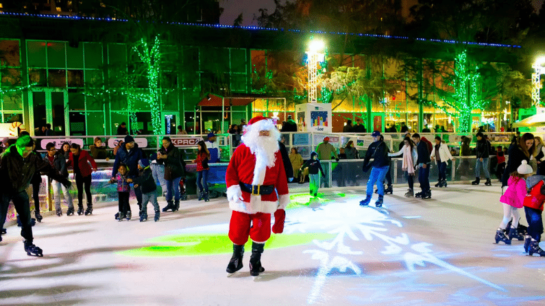 Santa ice skating in Houston at Discoery Green